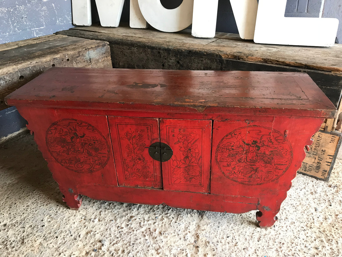 A large red Chinese temple chest