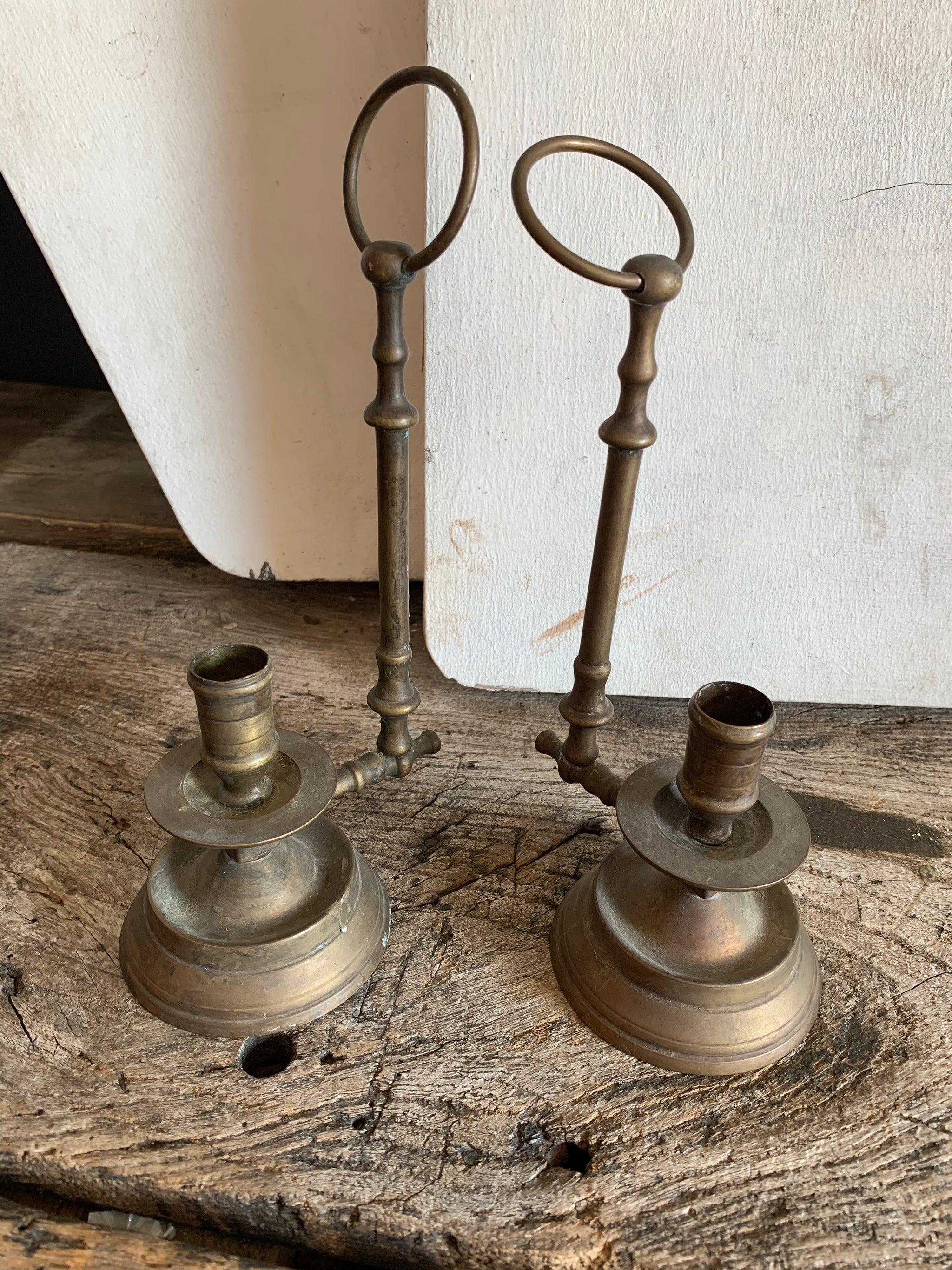 A pair of brass "Wee Willie Winkie" style chambersticks