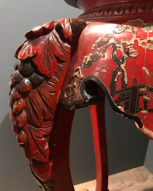An Oriental red lacquer jardinière stand