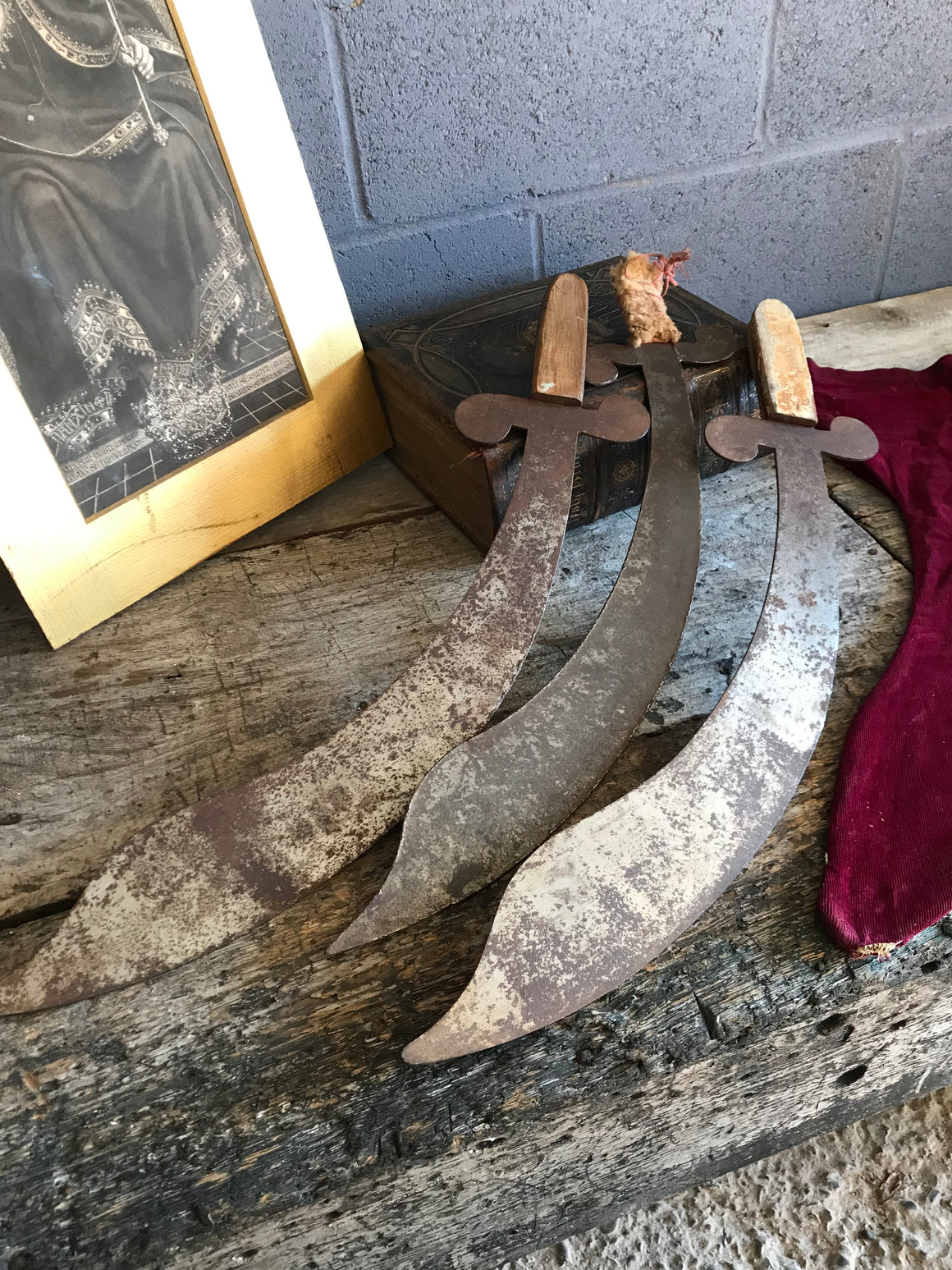 A trio of hand forged metal demonstration or juggling cutlass swords