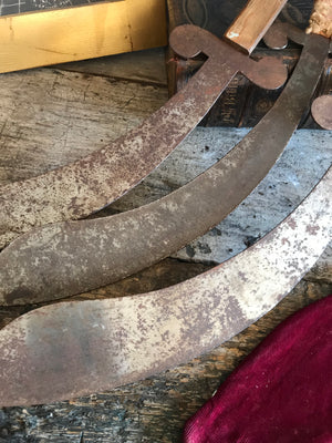 A trio of hand forged metal demonstration or juggling cutlass swords