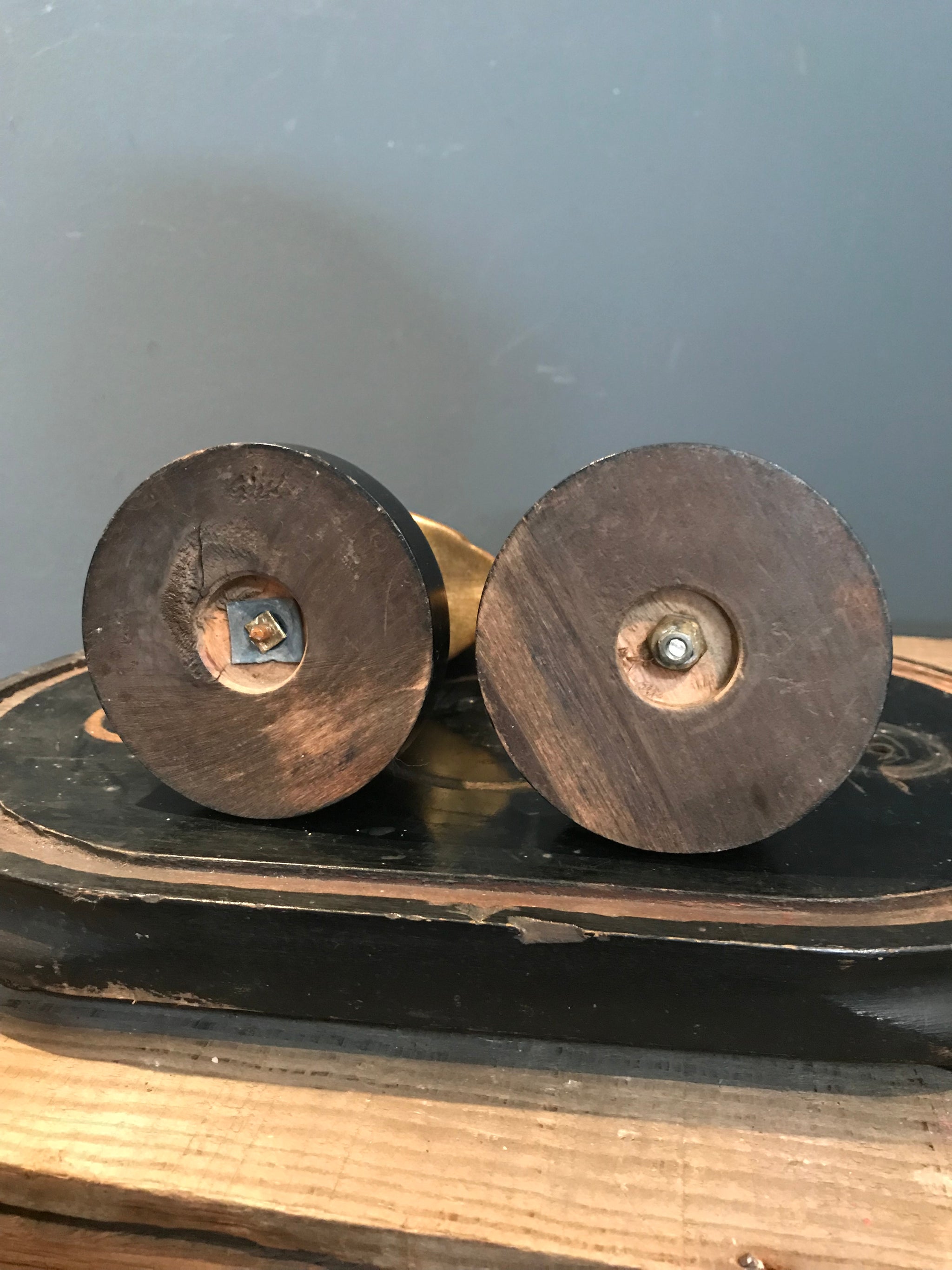 A pair of gilt spelter Gentleman and Lady busts on ebonised bases