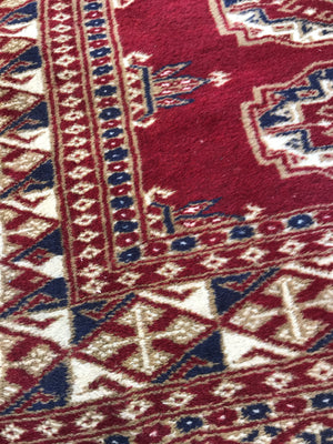 A pair of hand knotted red wool Persian rectangular carpet rugs