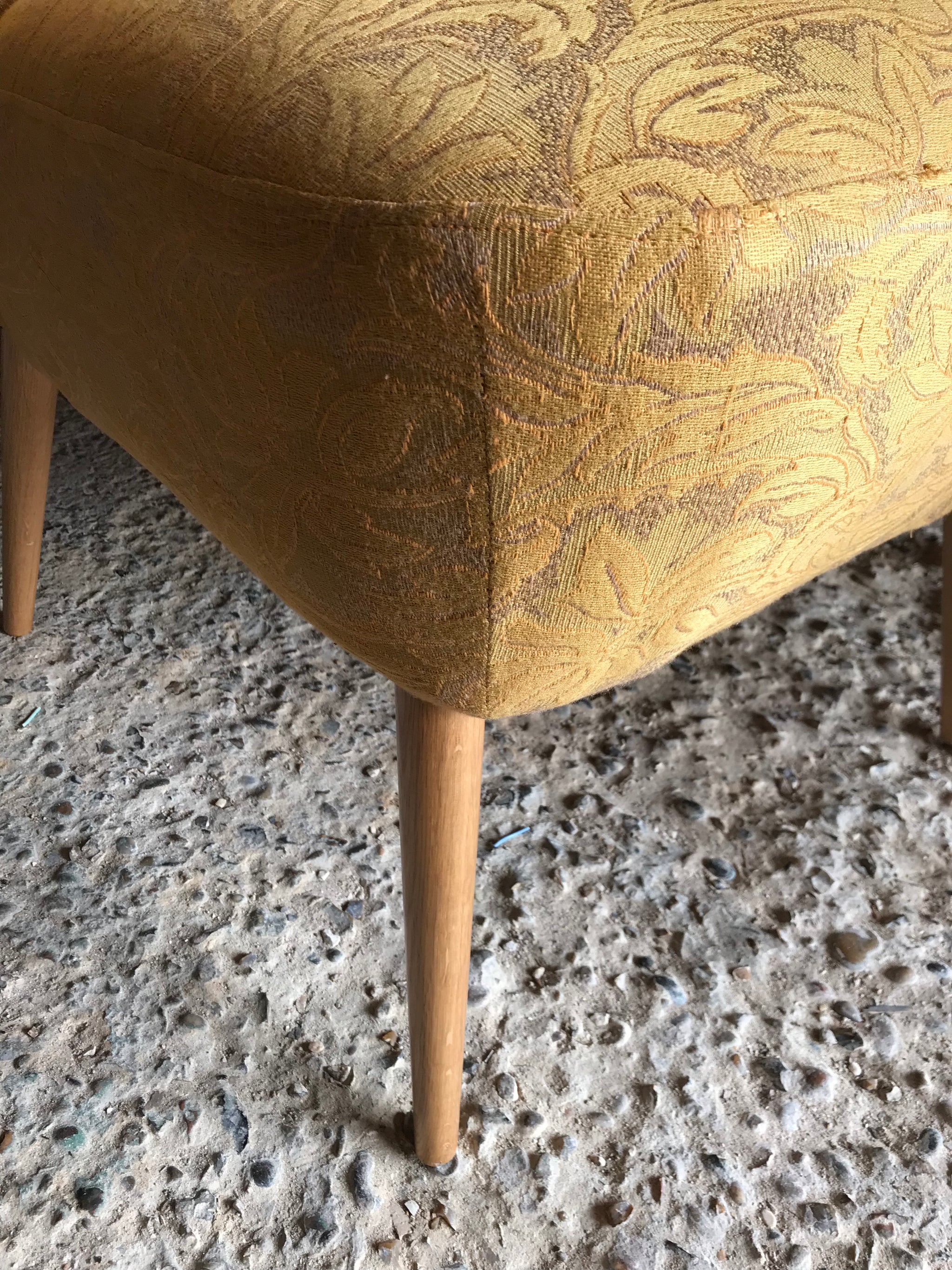 A pair of mid century modern mustard shell back cocktail chairs