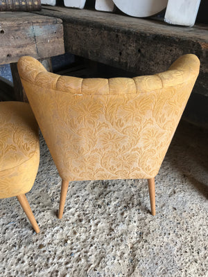 A pair of mid century modern mustard shell back cocktail chairs