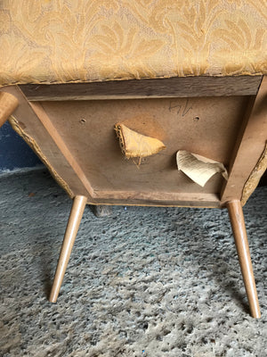 A pair of mid century modern mustard shell back cocktail chairs