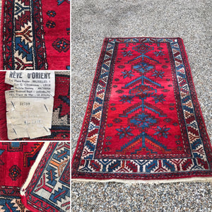 A rectangular red-ground wool Persian Mossoul carpet rug