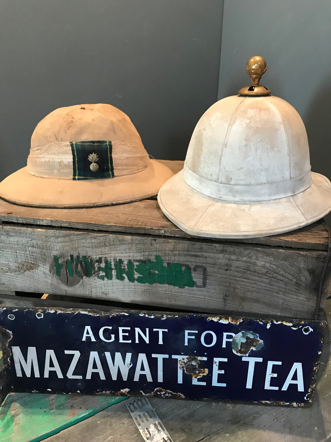 A Pair of Colonial Military Pith Helmets and Case