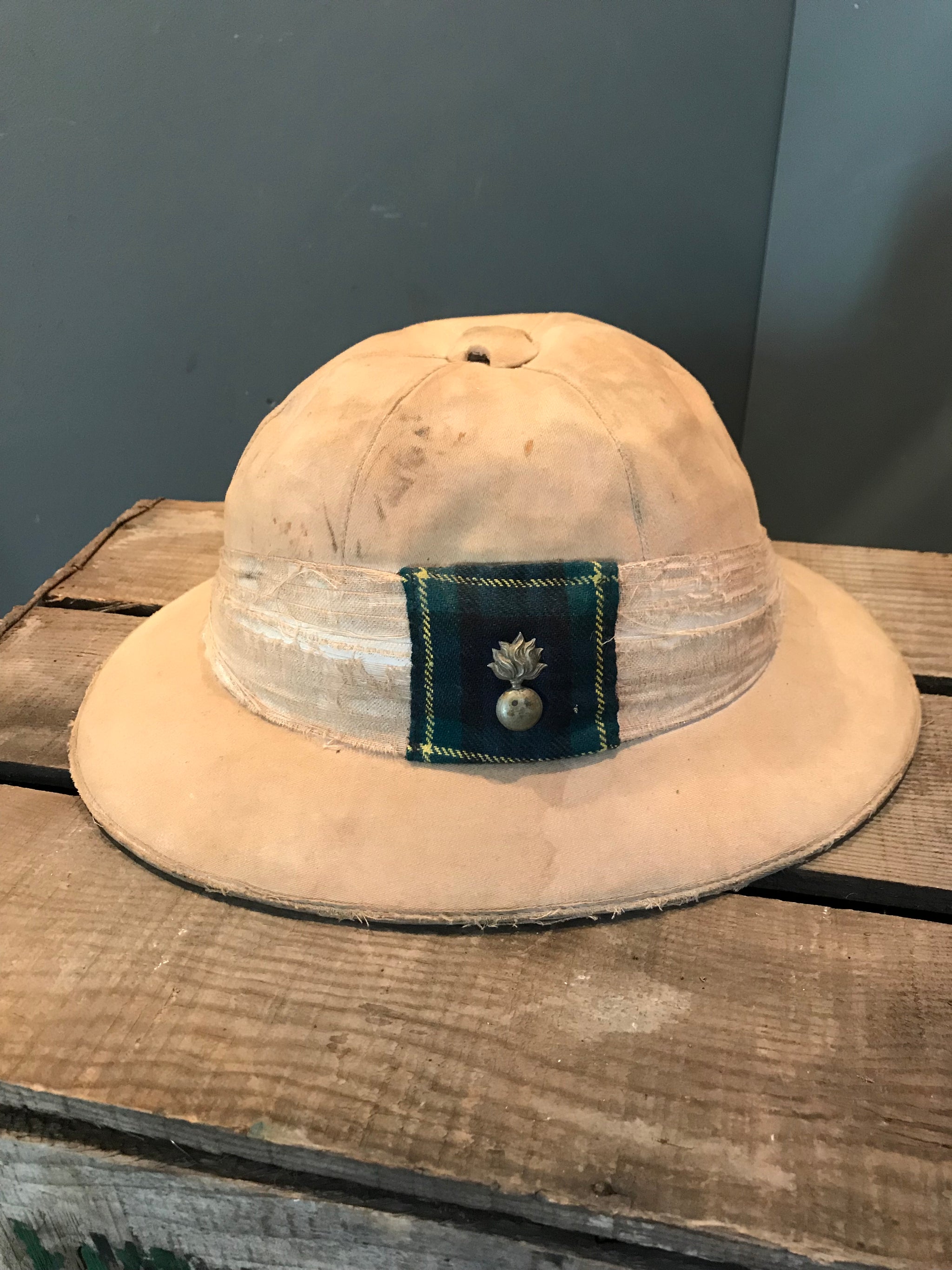 A Pair of Colonial Military Pith Helmets and Case