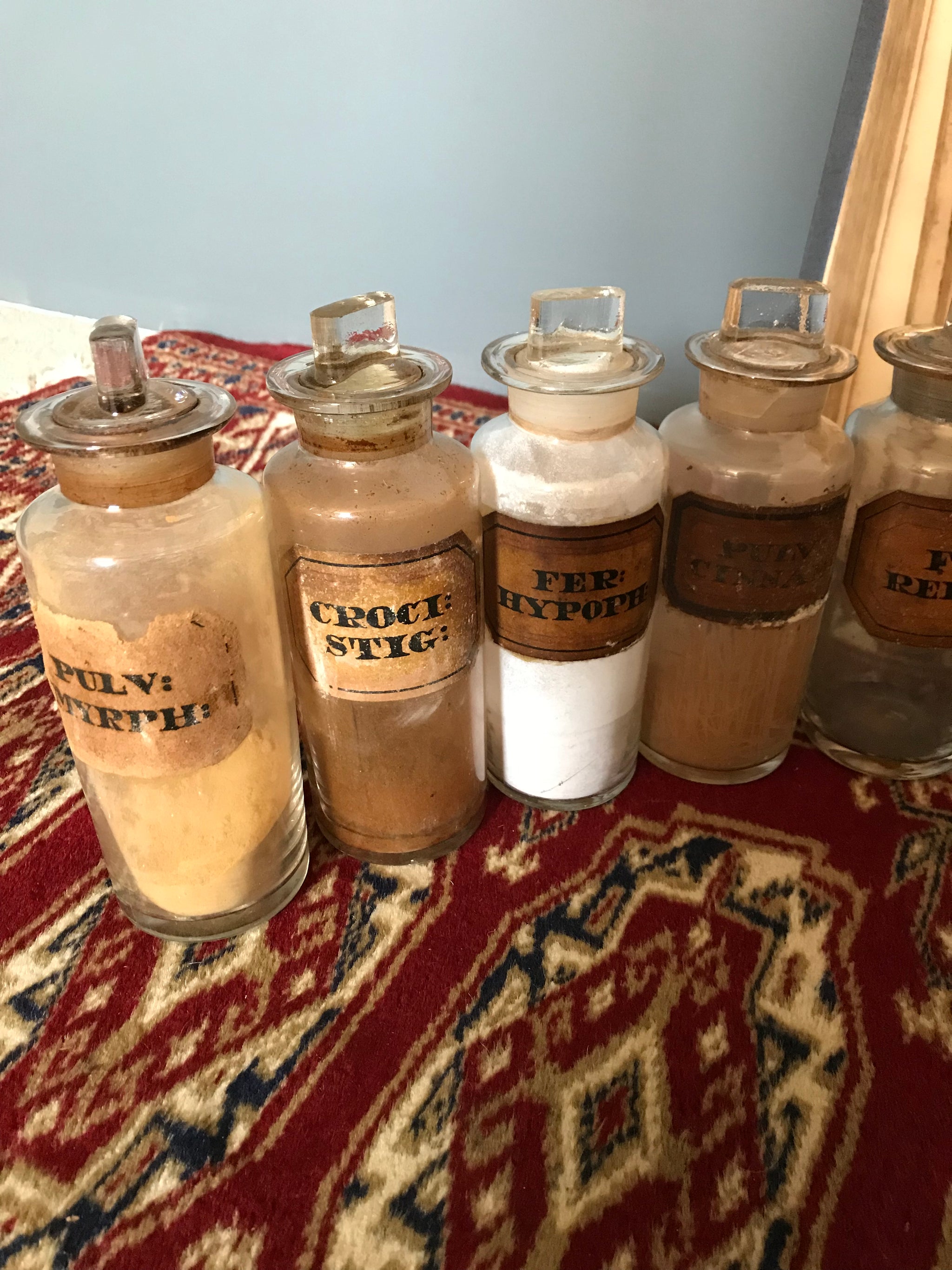 A set of 17 19th Century glass apothecary bottles or jars