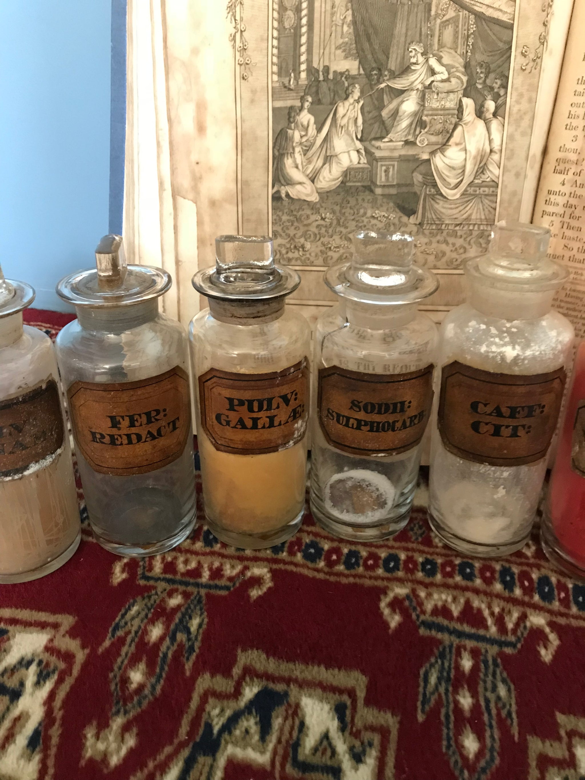 A set of 17 19th Century glass apothecary bottles or jars