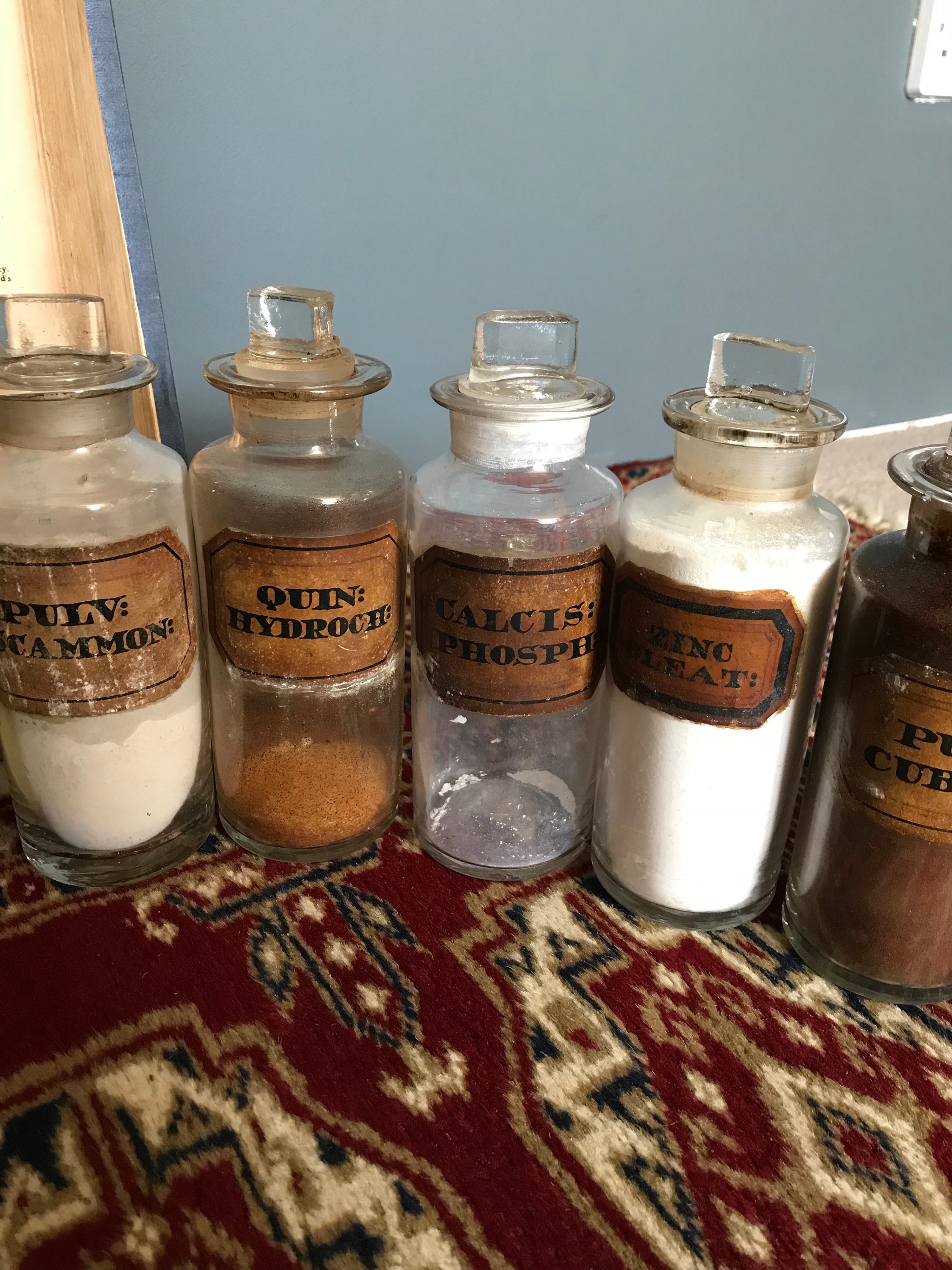 A set of 17 19th Century glass apothecary bottles or jars
