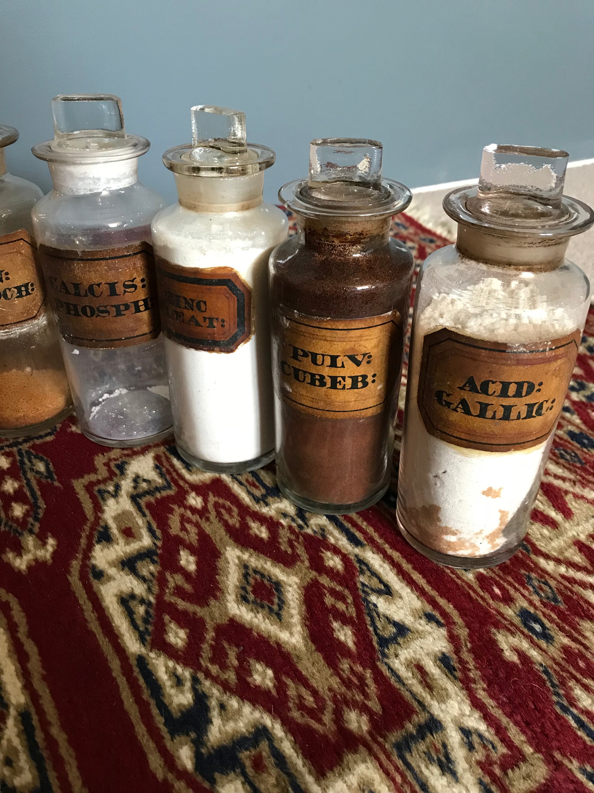 A set of 17 19th Century glass apothecary bottles or jars