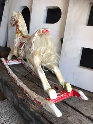 A vintage Rowlands Fun Fair carousel rocking horse