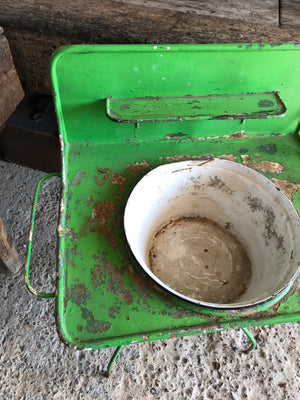 A shabby chic green metal wash stand with enamel basin