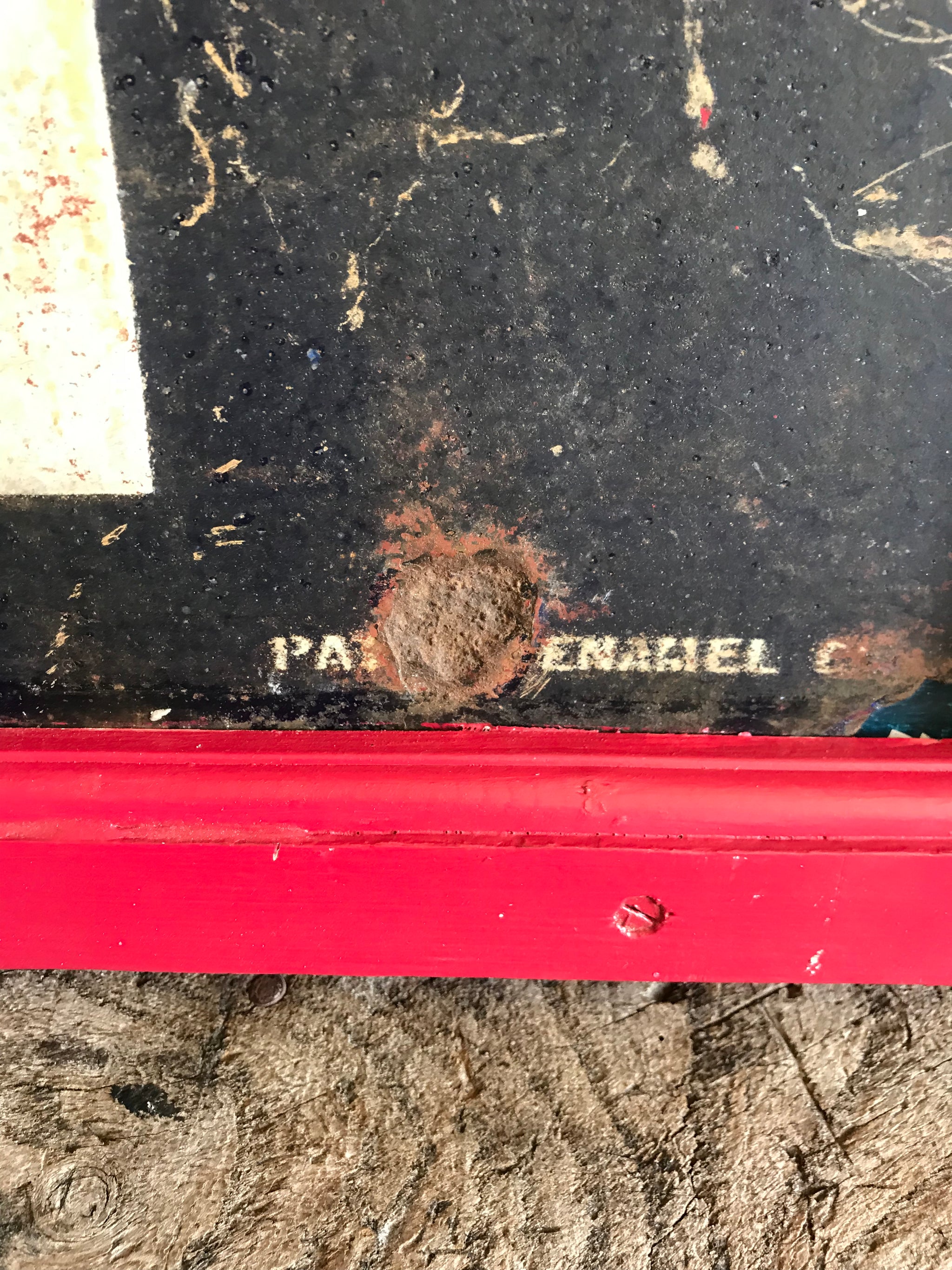 A large enamel GENTLEMEN sign in a wooden frame
