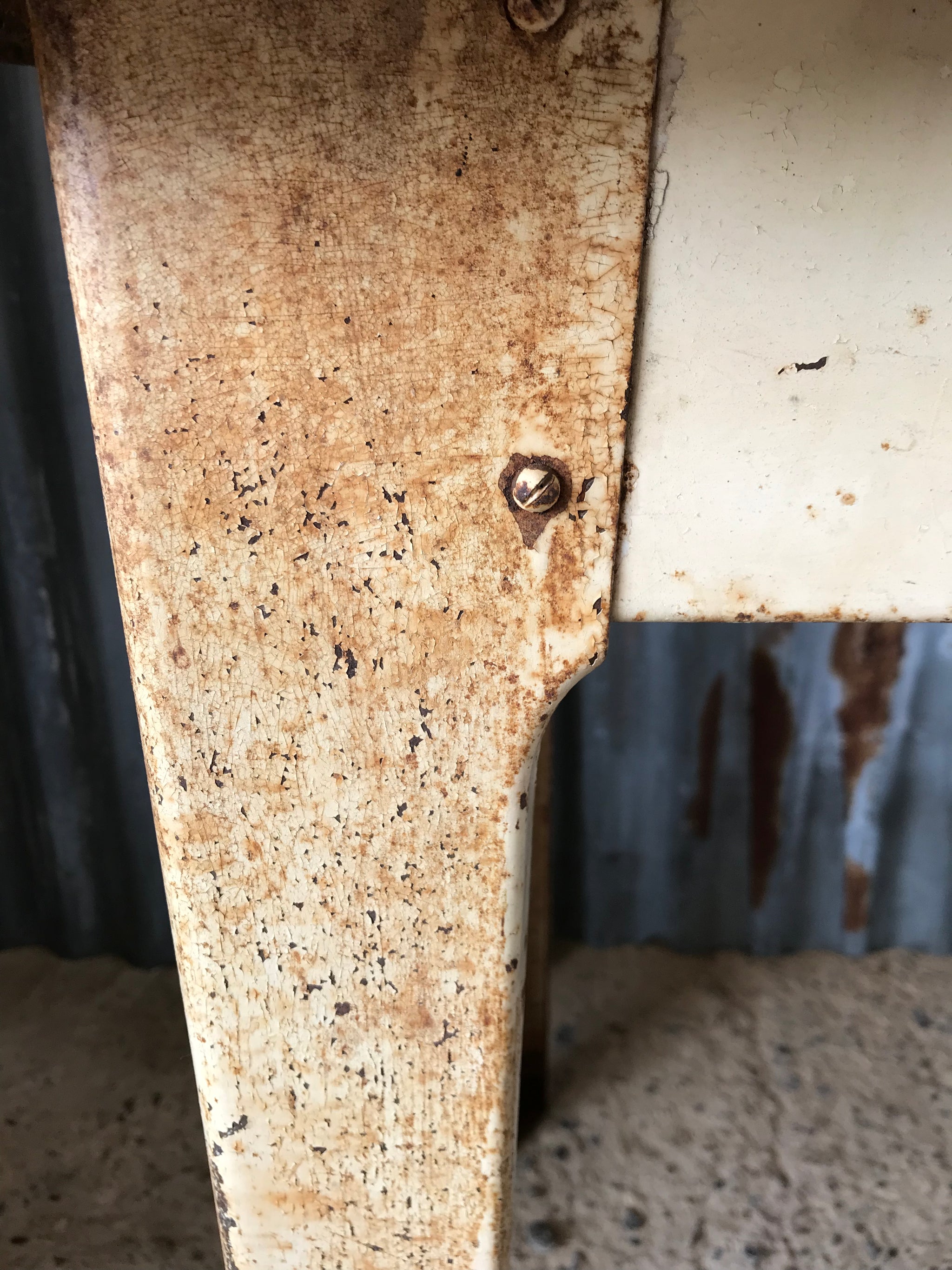 A rustic metal table with enamel top