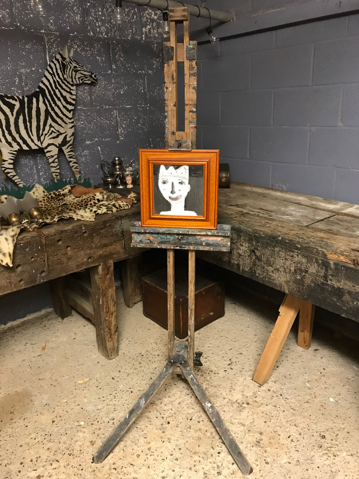 An oak floor standing studio artist's easel