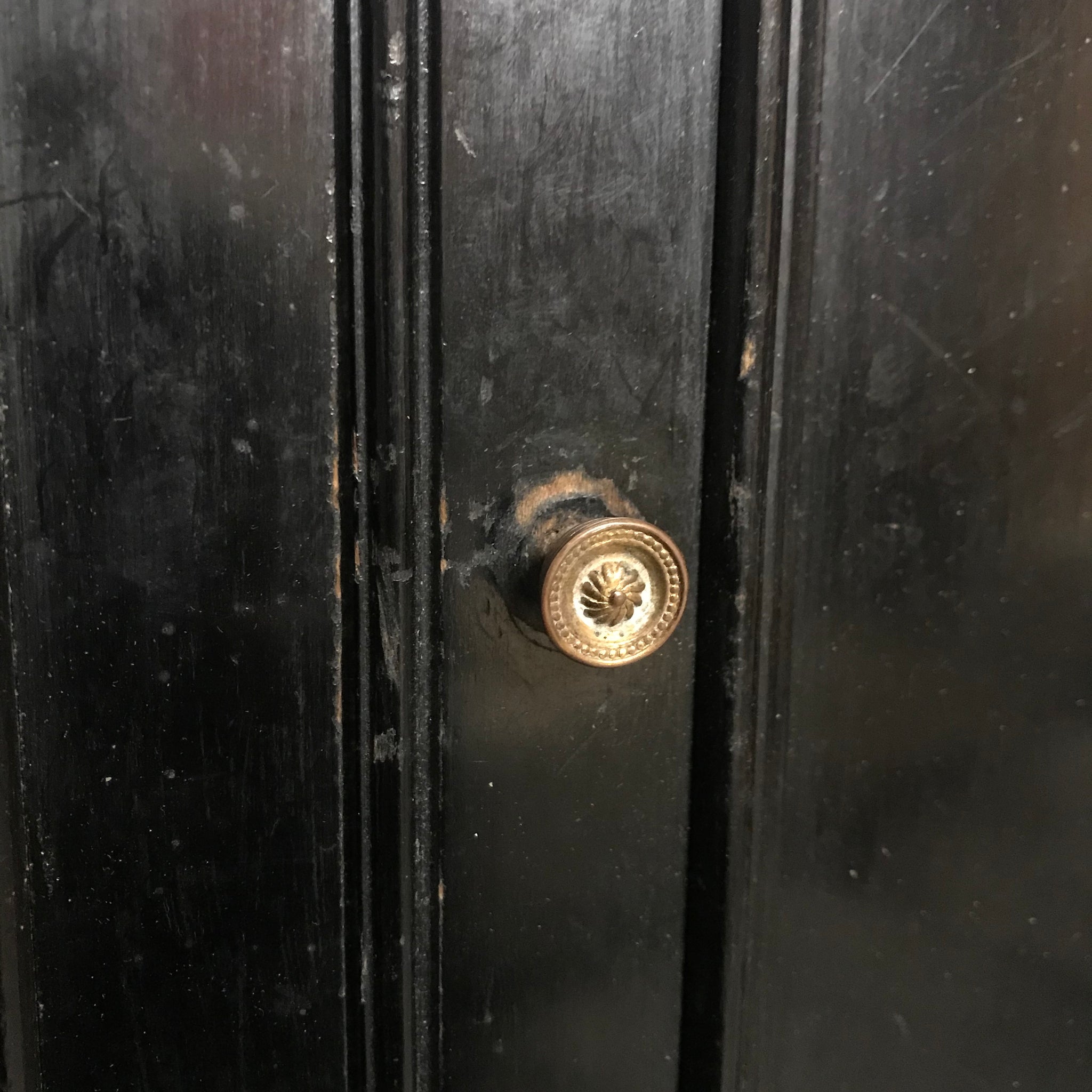 A black ebonised trophy display cabinet with red velvet inlay