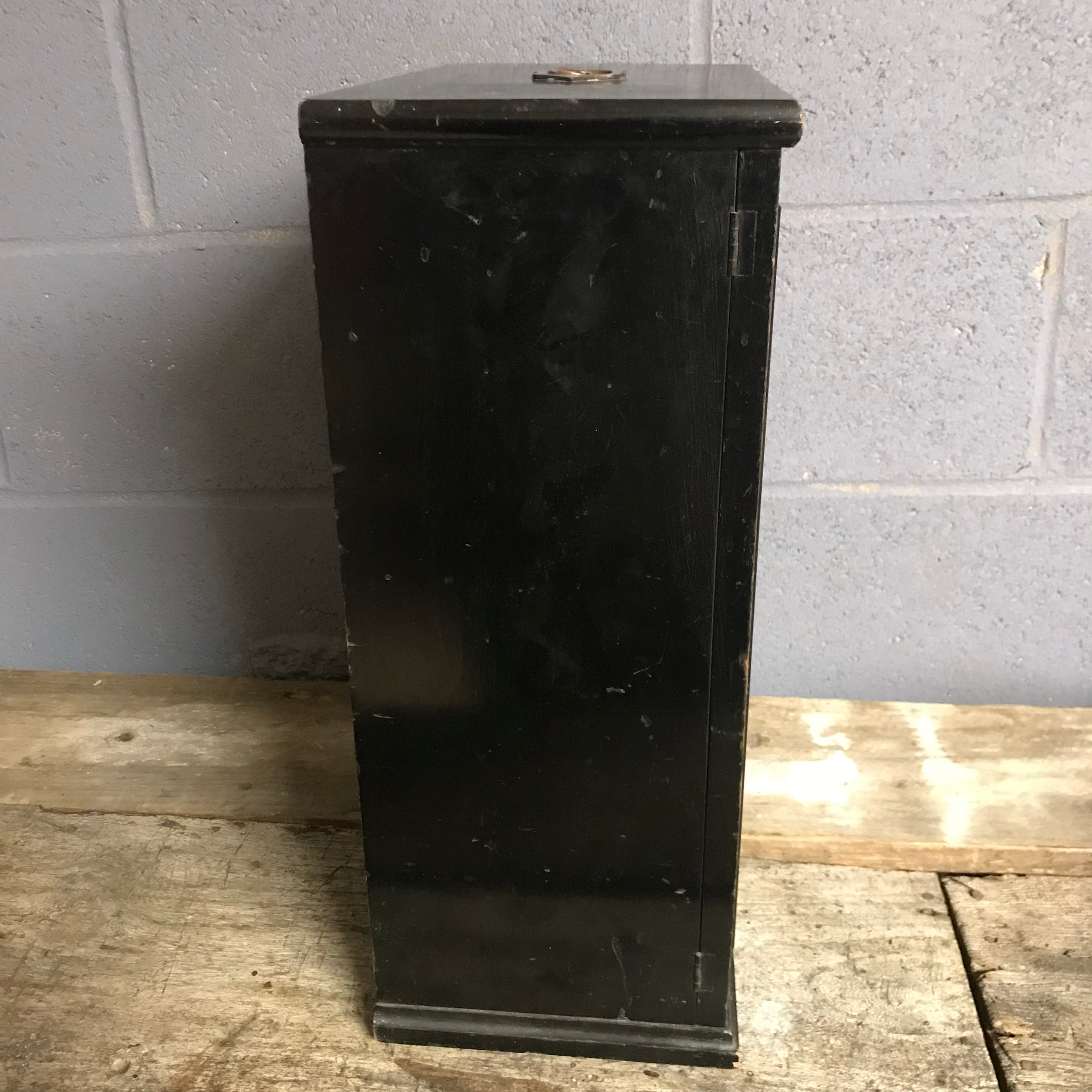 A black ebonised trophy display cabinet with red velvet inlay