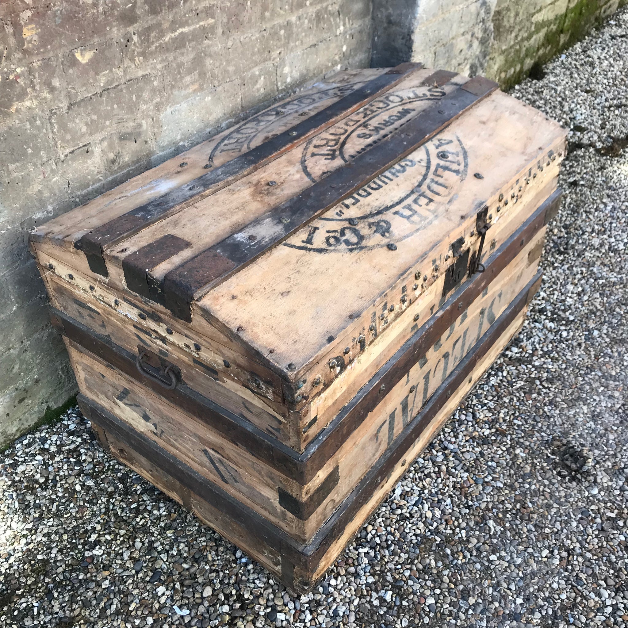 A Large Stripped Wooden Trunk with Domed Top and Stud Detailing