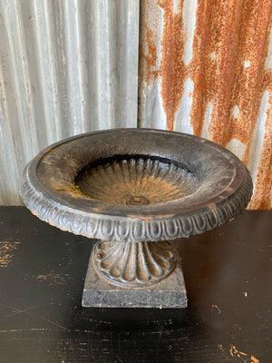 A cast iron black tazza urn