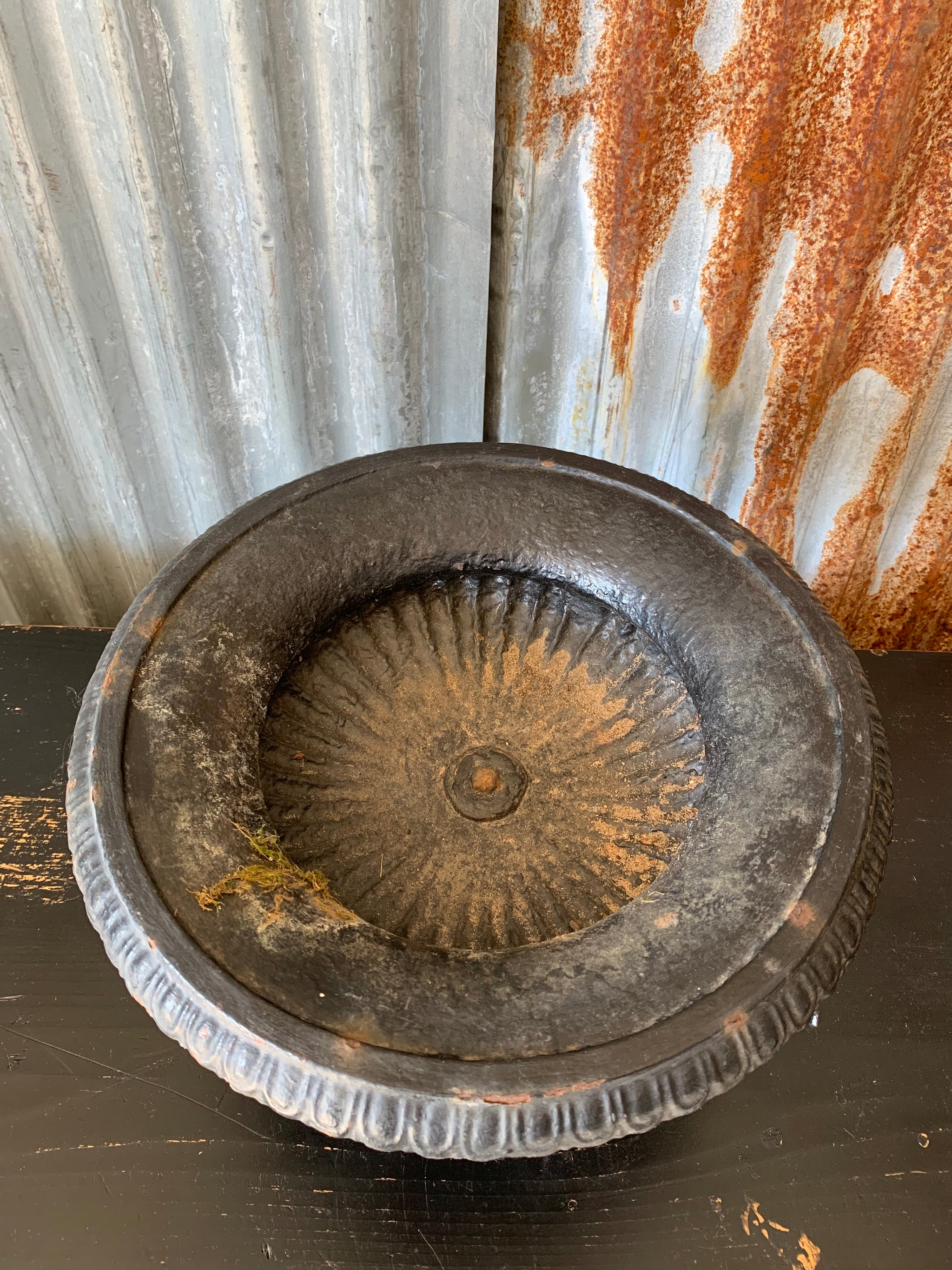 A cast iron black tazza urn