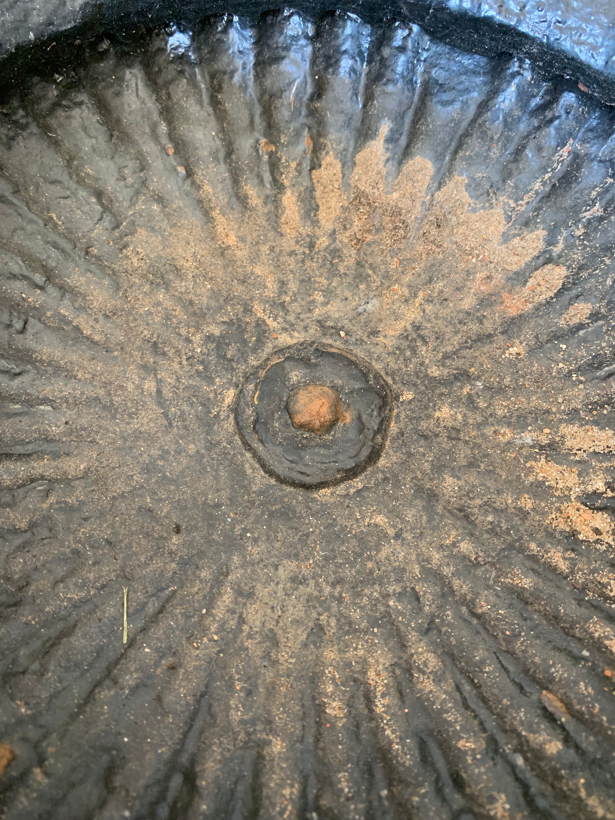 A cast iron black tazza urn