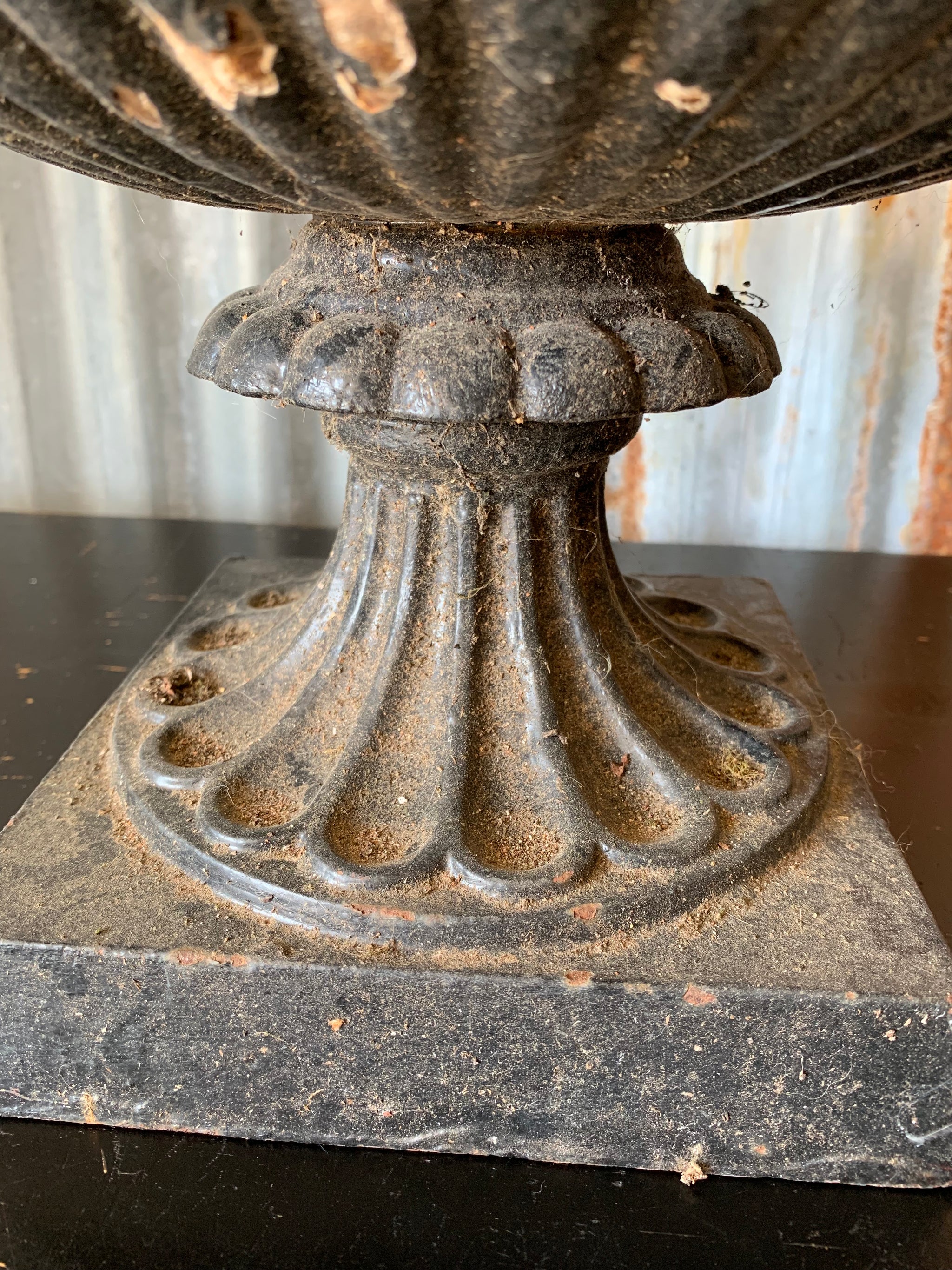 A cast iron black tazza urn