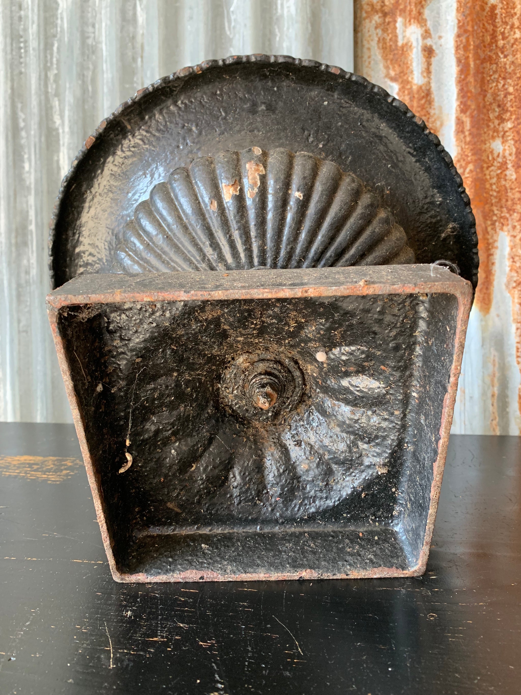 A cast iron black tazza urn