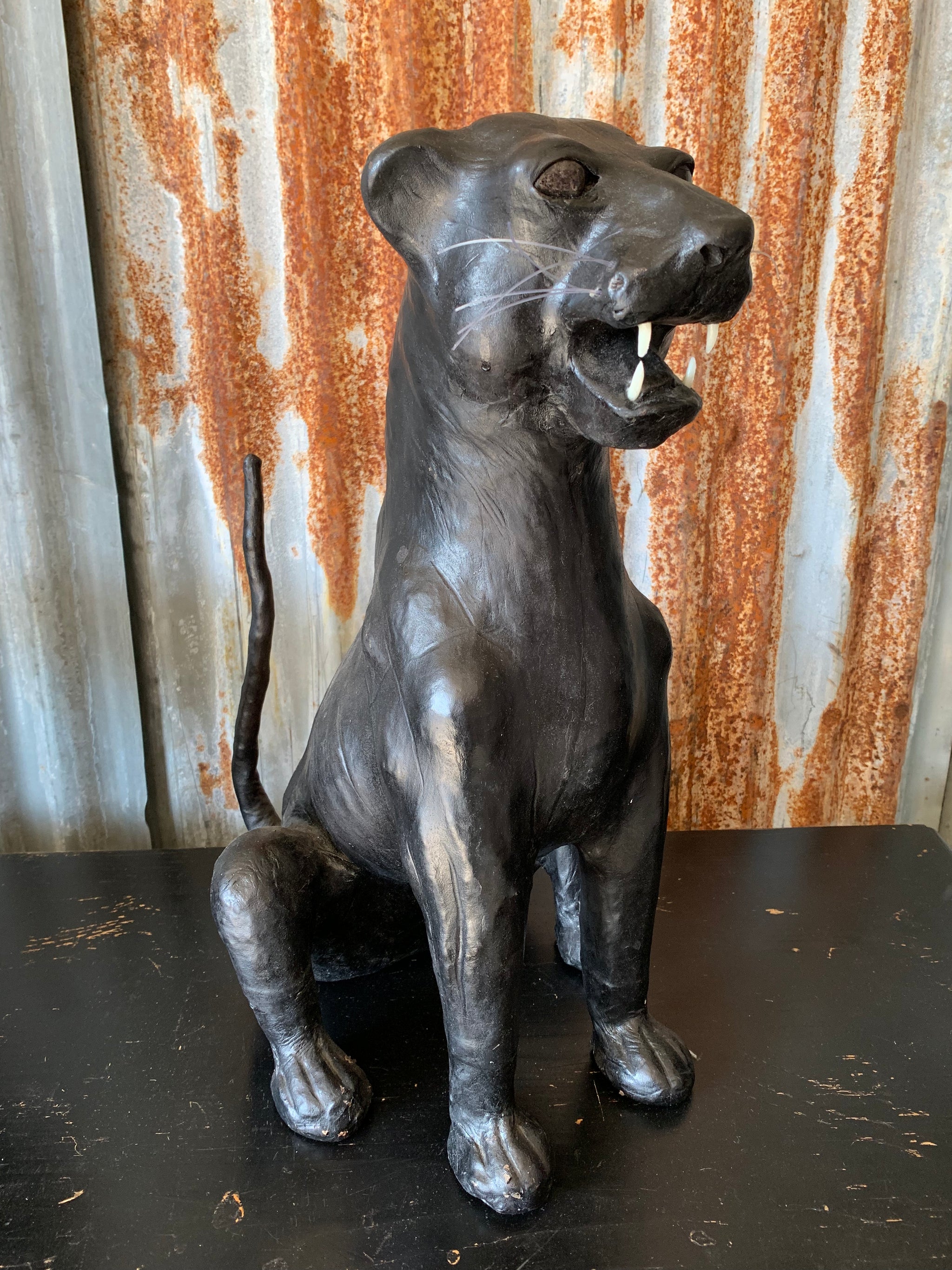 A large mid century black leather panther - Belle and Beast A large mid century black leather panther - Belle and Beast