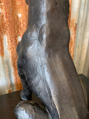 A large mid century black leather panther