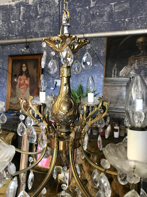 A large 8 arm crystal drop and gilt body chandelier