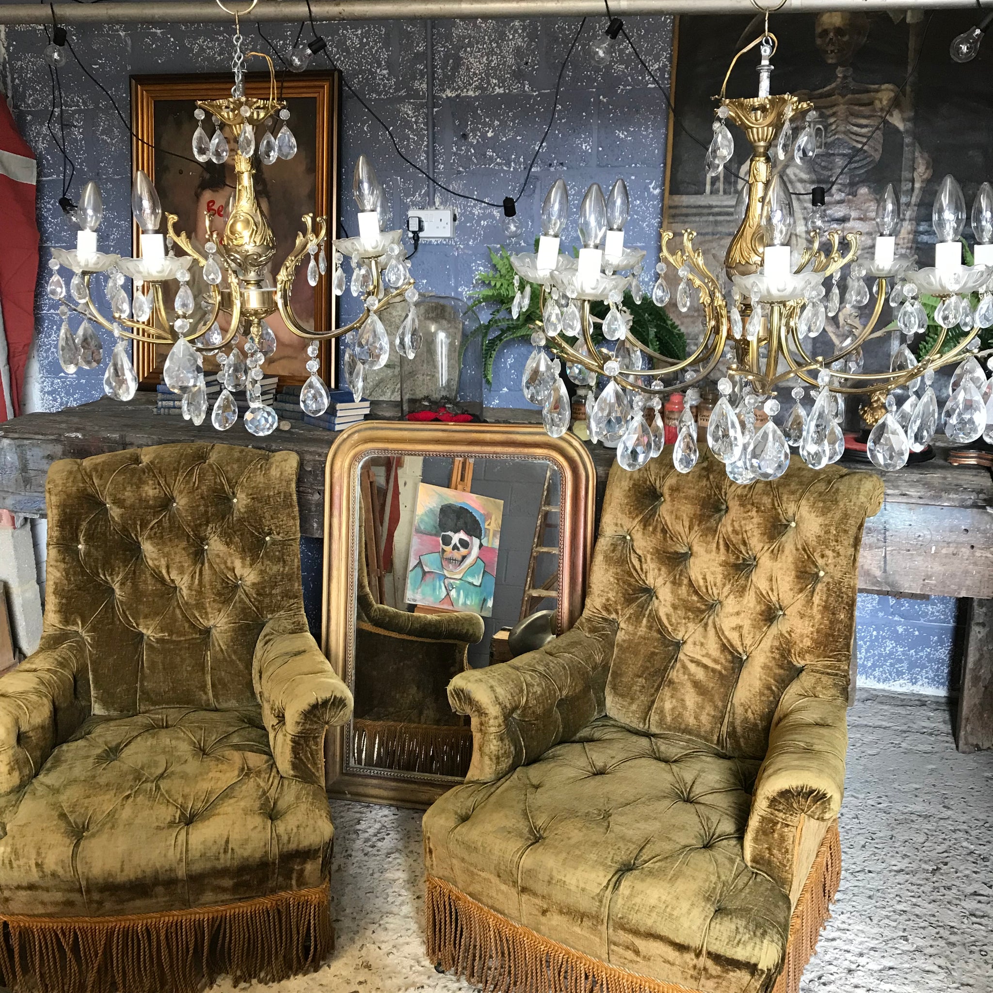 A medium 5 arm crystal drop and gilt body chandelier