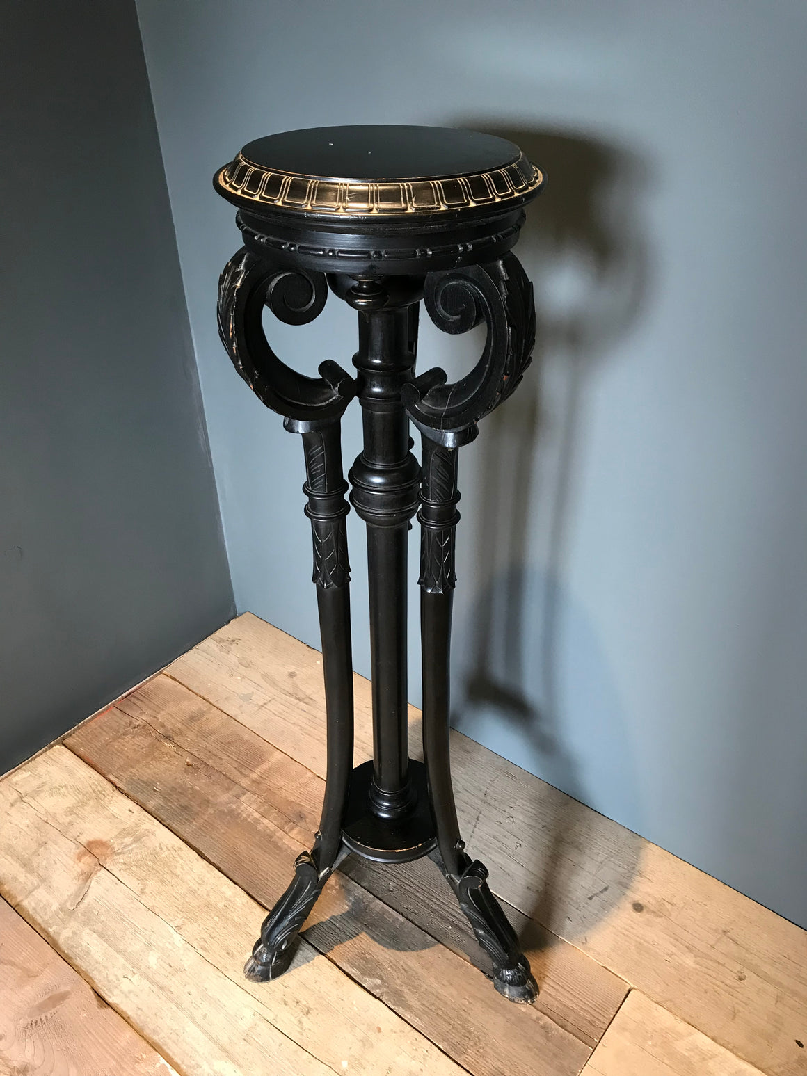 A Gothic goat hoof ebonised jardiniere plant display stand