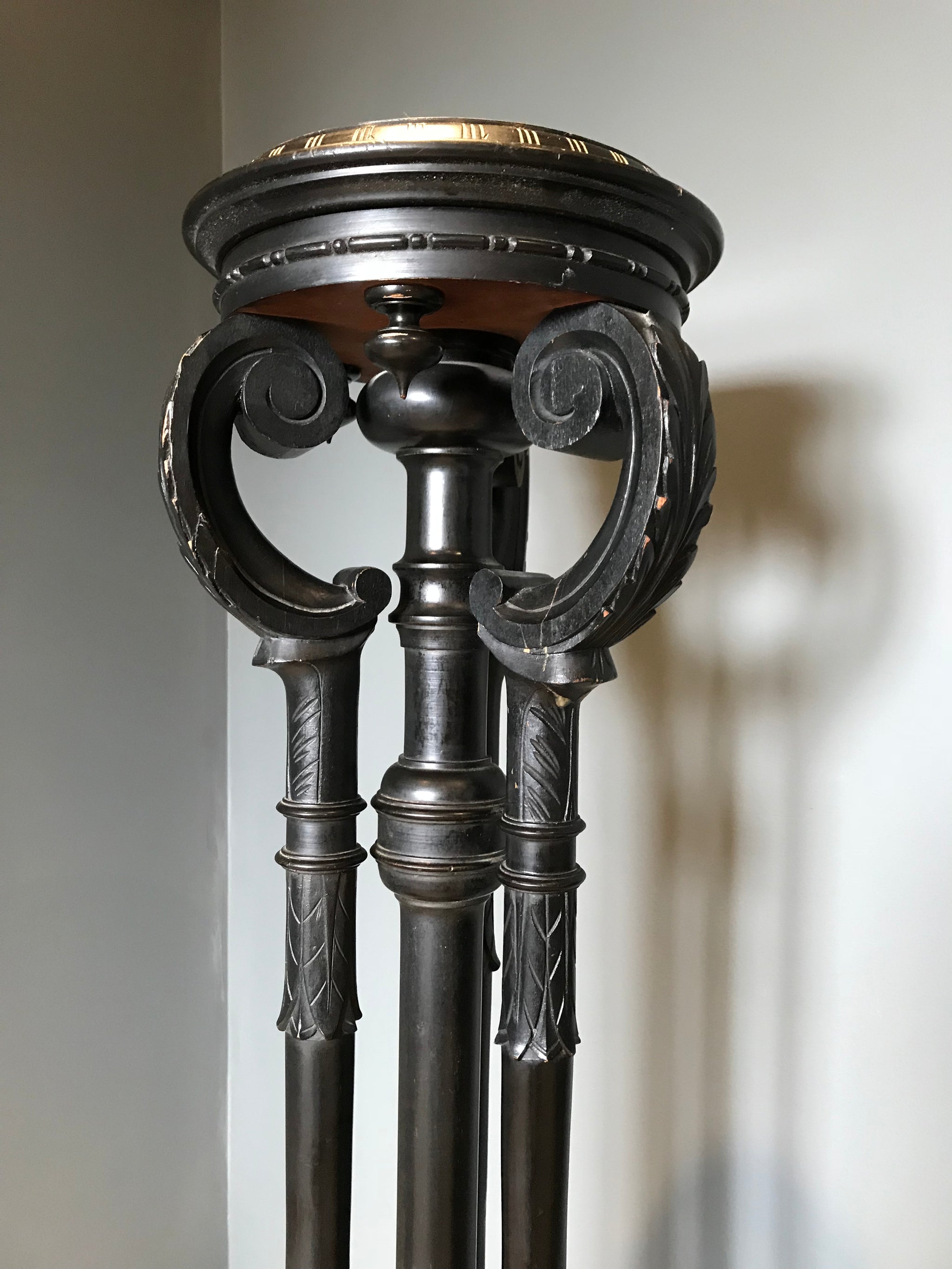 A Gothic goat hoof ebonised jardiniere plant display stand