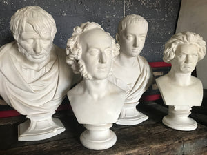 A large 19th Century Neoclassical Roman bust of Severus Alexander in white plaster