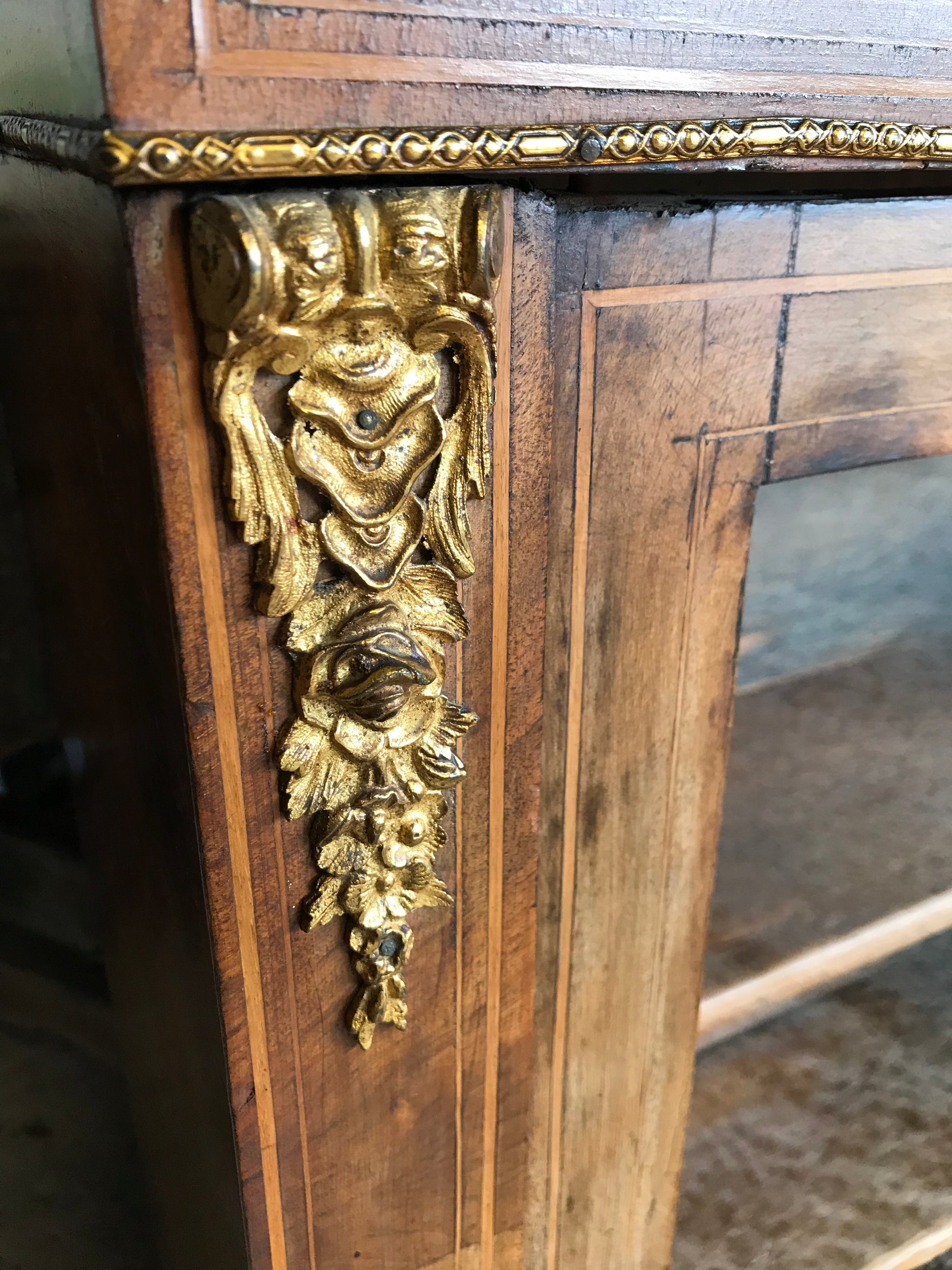 A Victorian single door inlaid walnut pier display cabinet