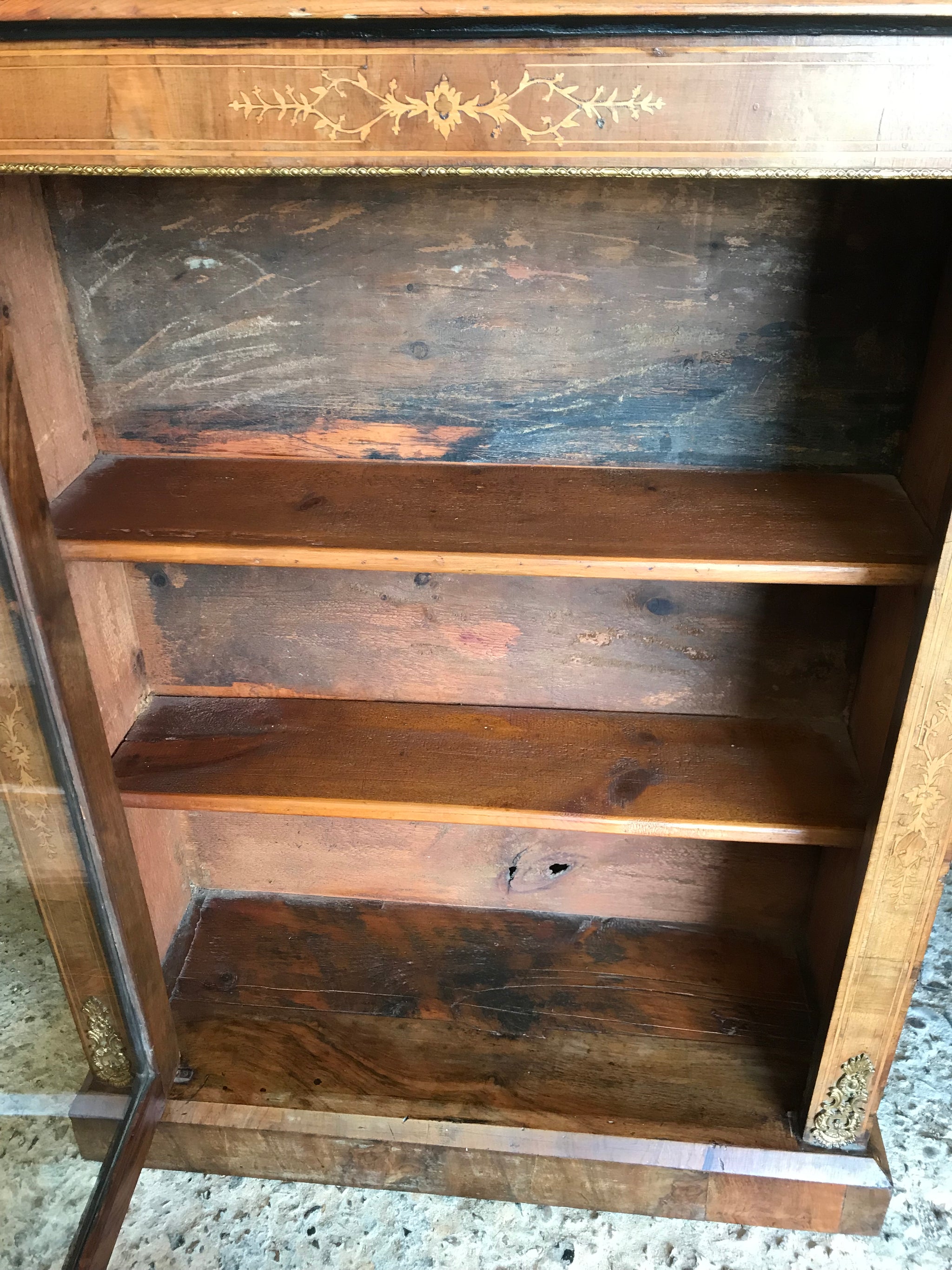 A Victorian single door inlaid walnut pier display cabinet