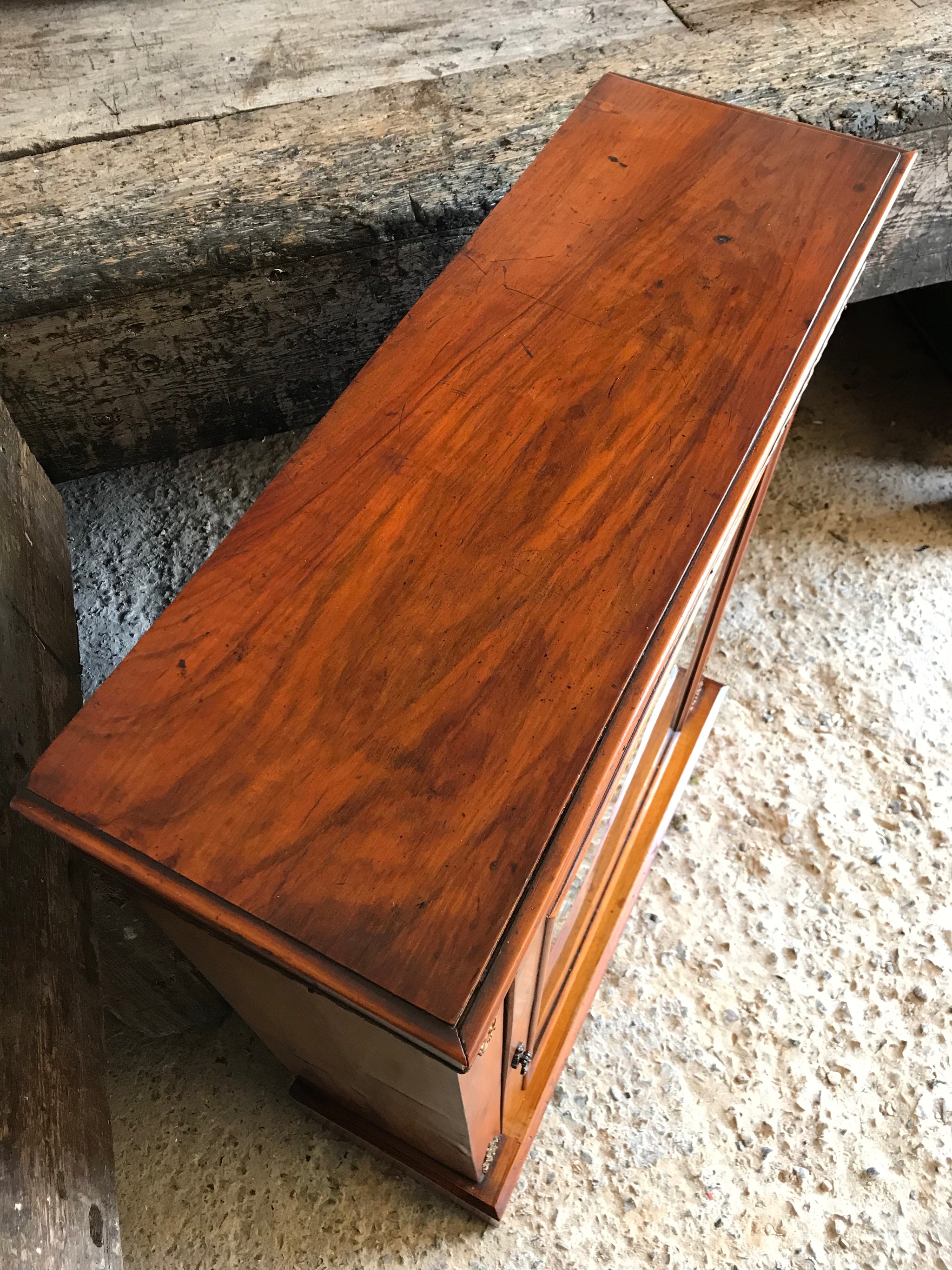 A Victorian single door inlaid pier display cabinet