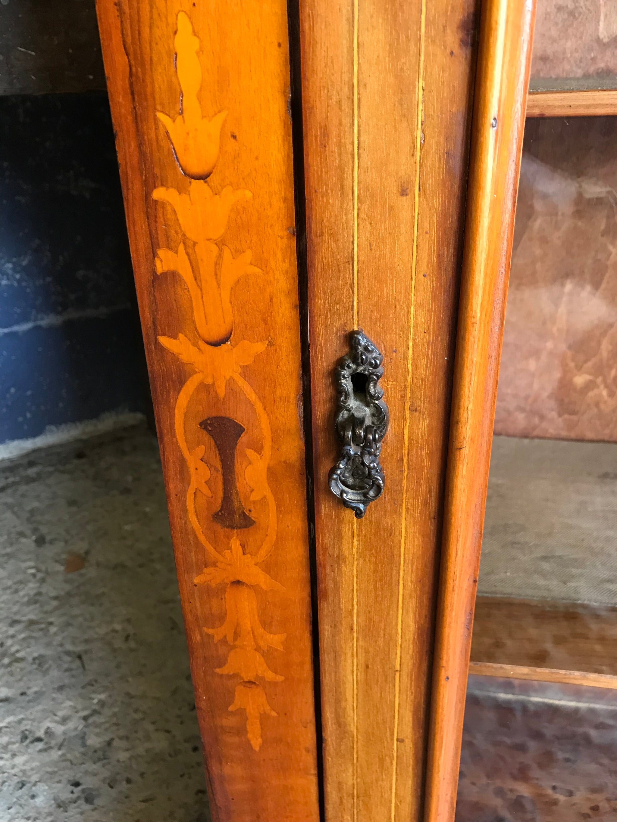 A Victorian single door inlaid pier display cabinet