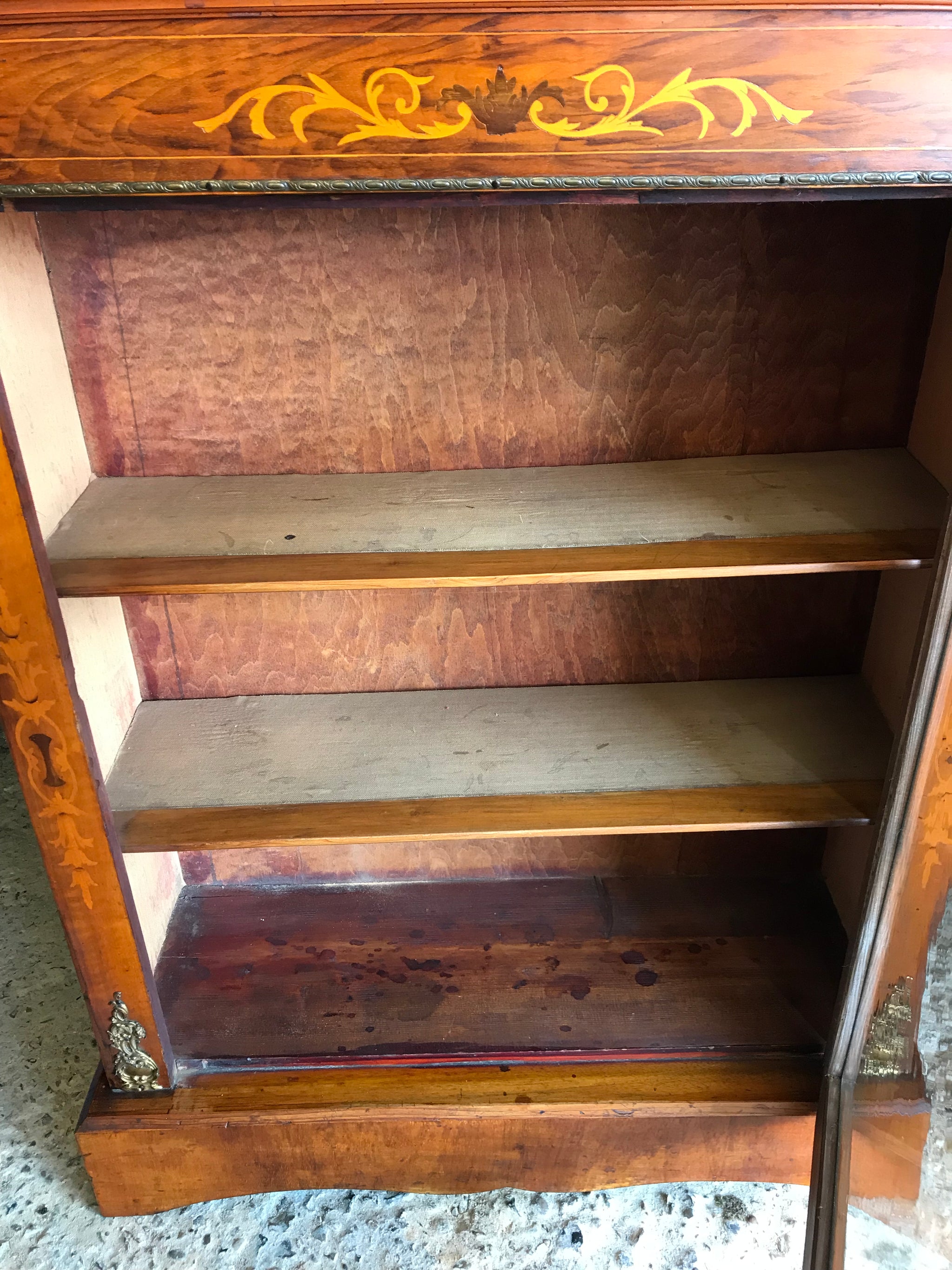 A Victorian single door inlaid pier display cabinet