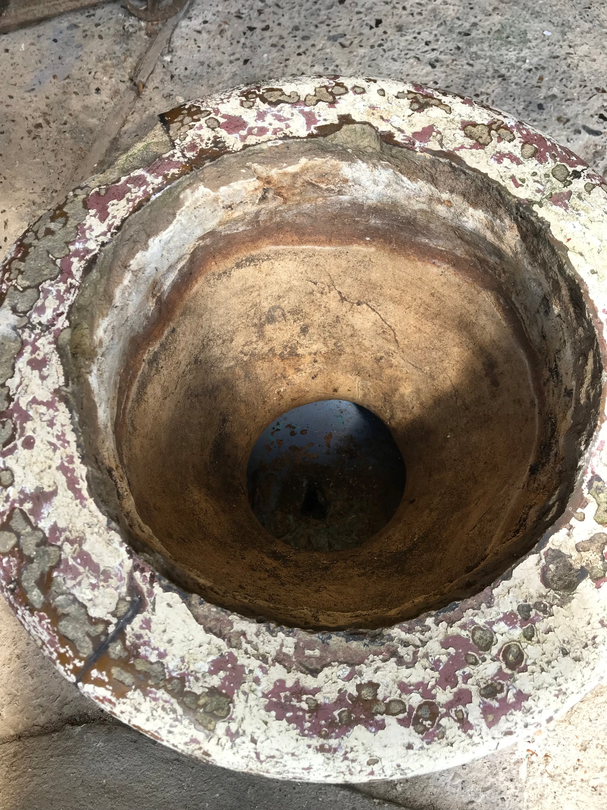 A large terracotta country house urn on plinth
