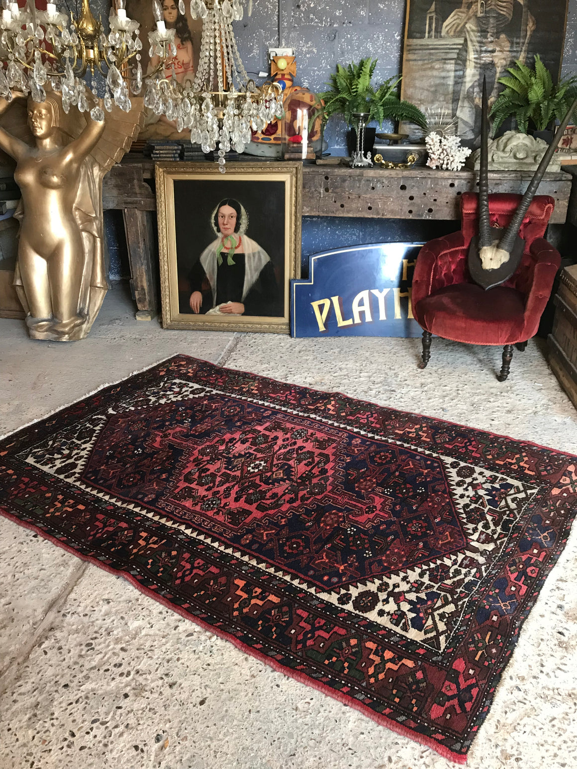A red ground wool Persian rug