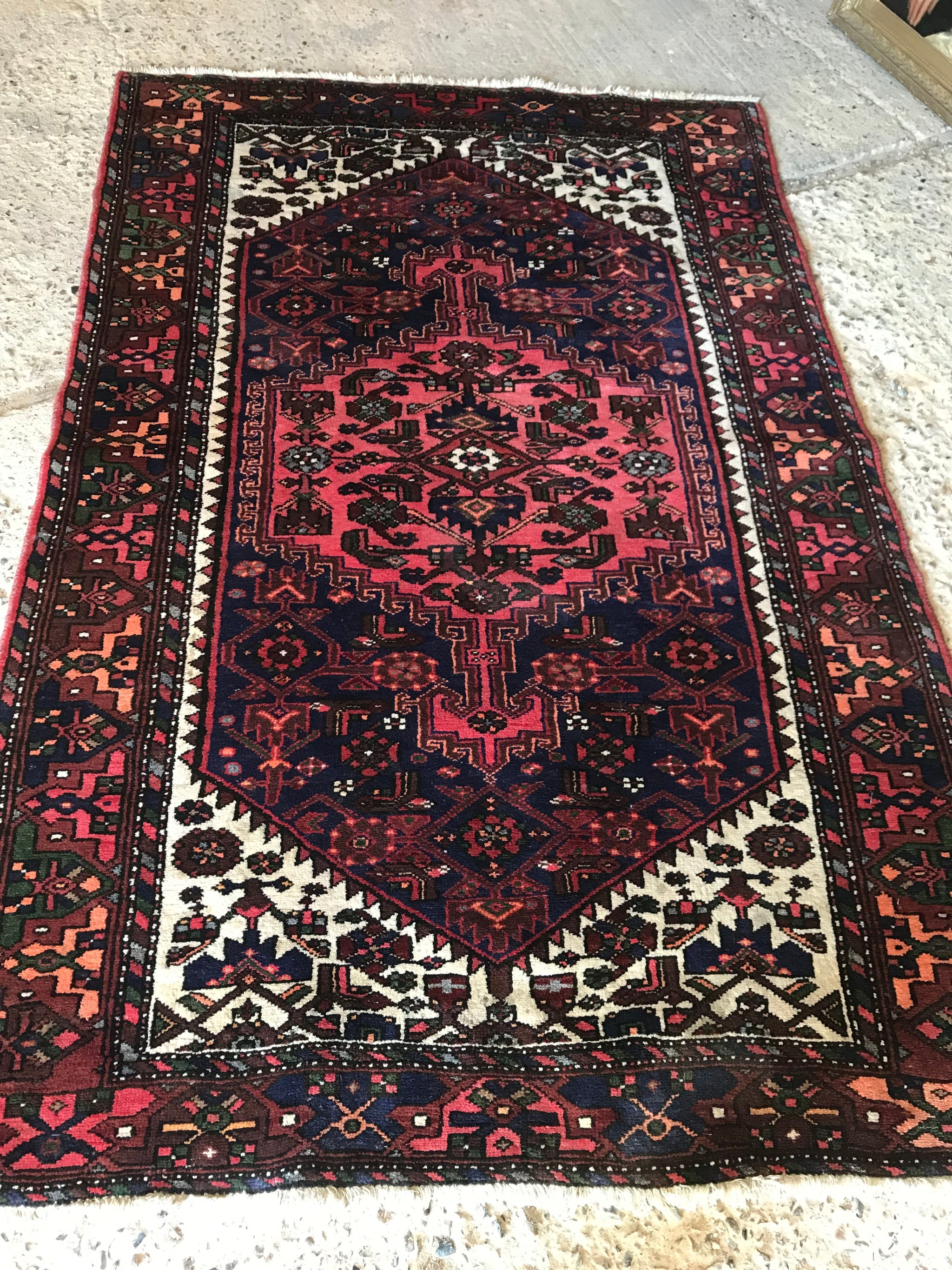 A red ground wool Persian rug