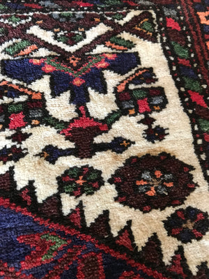 A red ground wool Persian rug