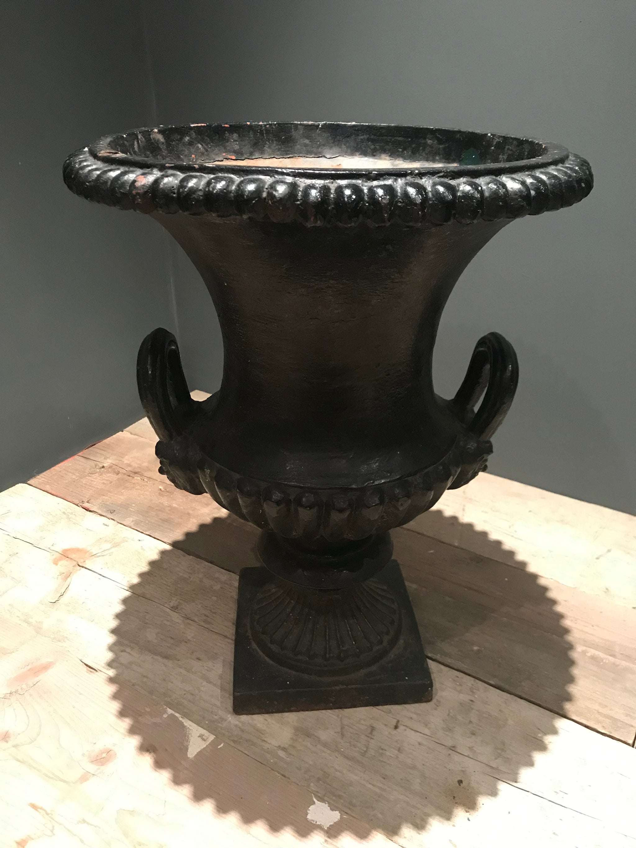 A 19th century black cast iron garden urn