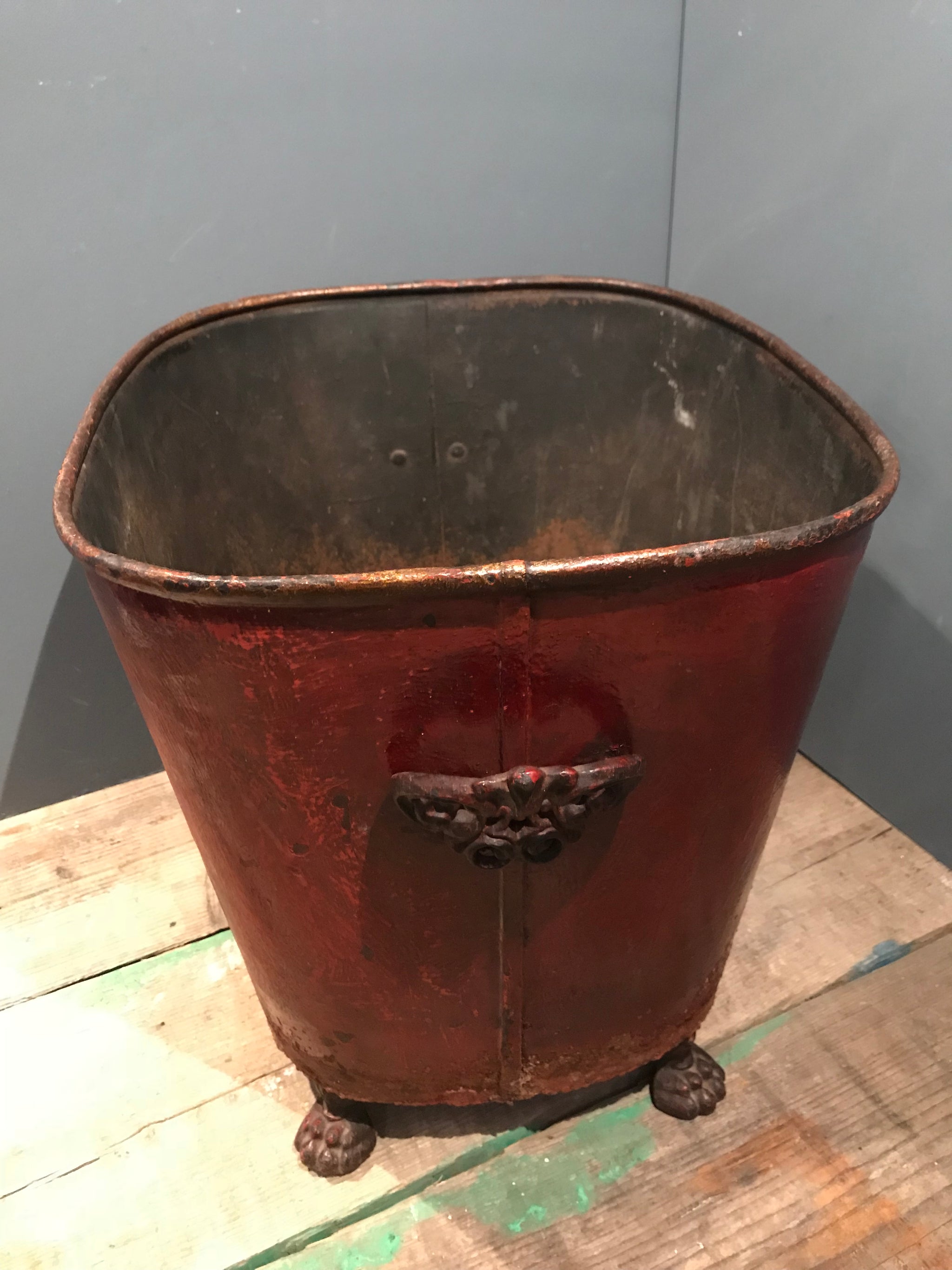 A heraldic chateau fireside log bucket