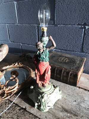 A cold painted spelter figural lady lamp