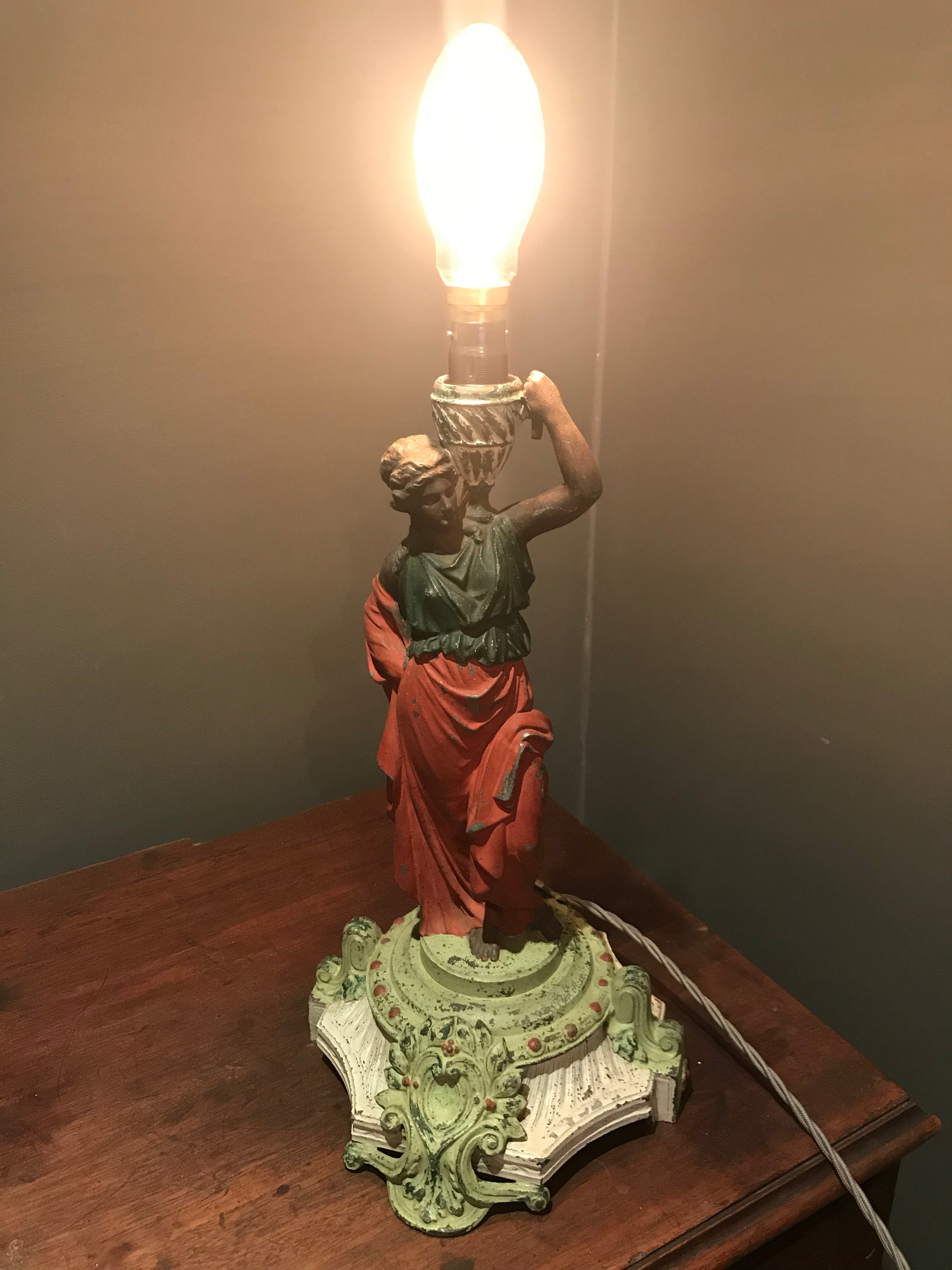 A cold painted spelter figural lady lamp